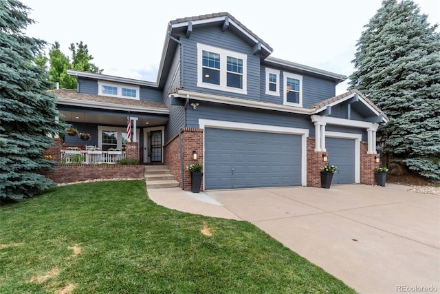 craftsman-style house with a garage, covered porch, and a front lawn