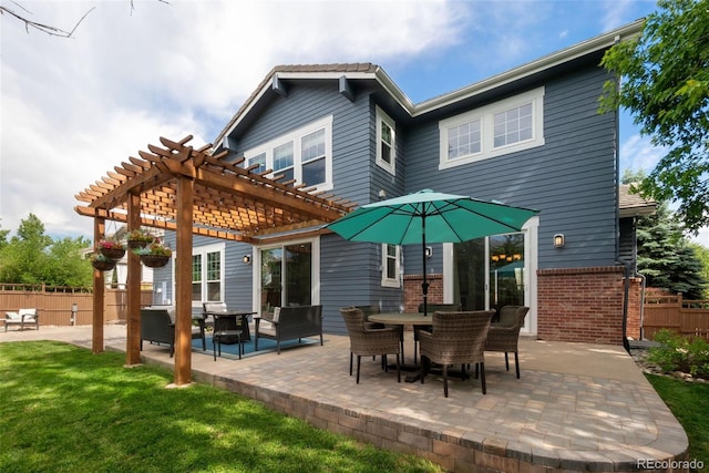 rear view of house with a pergola, a lawn, outdoor lounge area, and a patio