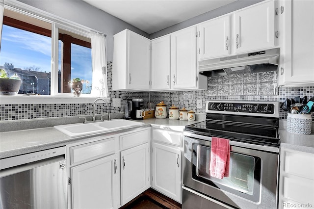 kitchen featuring white cabinetry, sink, ventilation hood, backsplash, and appliances with stainless steel finishes