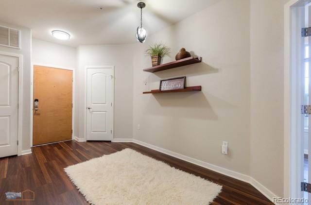 13456 Via Varra Unit 114, Broomfield, CO 80020 - interior space featuring baseboards, wood finished floors, and visible vents