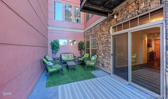 13456 Via Varra Unit 114, Broomfield, CO 80020 - exterior space with a deck and an outdoor living space