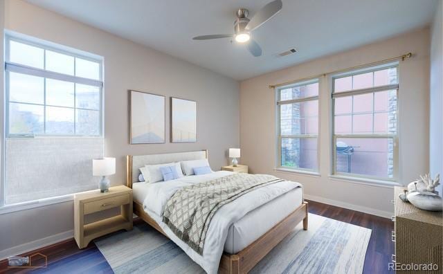 13456 Via Varra Unit 114, Broomfield, CO 80020 - bedroom with baseboards, multiple windows, and visible vents