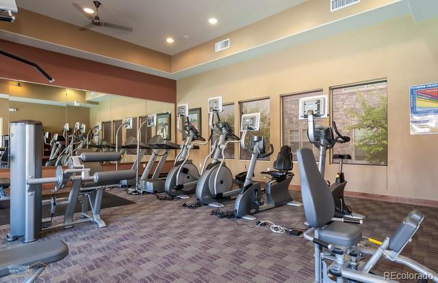 13456 Via Varra Unit 114, Broomfield, CO 80020 - exercise room featuring carpet flooring, a ceiling fan, visible vents, and recessed lighting