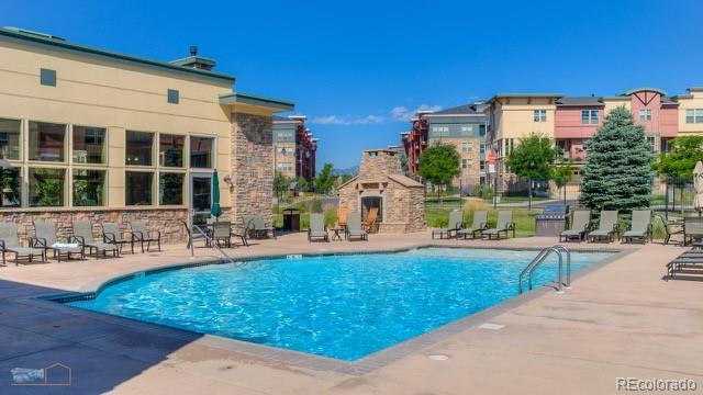 13456 Via Varra Unit 114, Broomfield, CO 80020 - community pool with a patio area