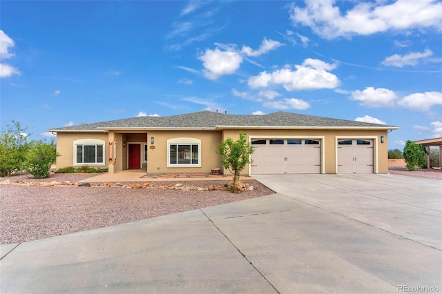 491 Newlin Ridge Rd, Florence, CO 81226 - ranch-style house with driveway, stucco siding, and a garage