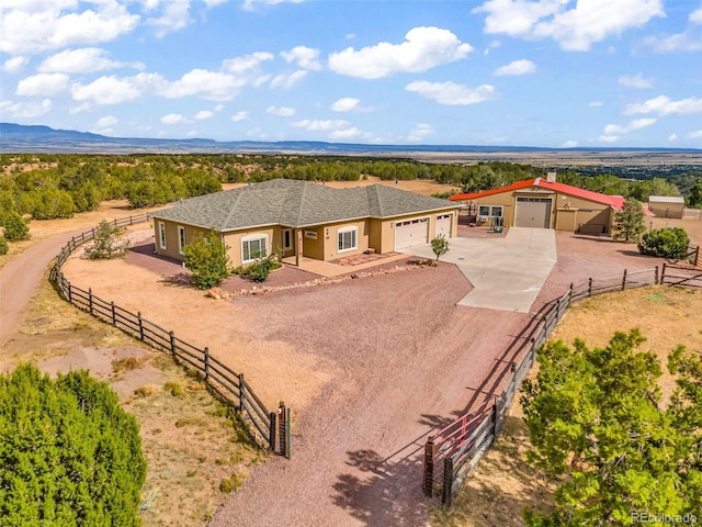 491 Newlin Ridge Rd, Florence, CO 81226 - ranch-style home featuring driveway, fence, stucco siding, an attached garage, and an outbuilding