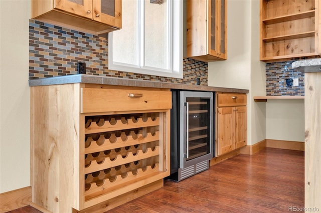 491 Newlin Ridge Rd, Florence, CO 81226 - bar area with beverage cooler, backsplash, dark wood-type flooring, and baseboards