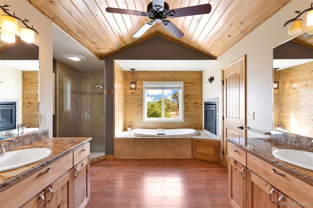 491 Newlin Ridge Rd, Florence, CO 81226 - full bathroom with hardwood / wood-style flooring, a shower stall, wooden ceiling, a bath, and two vanities