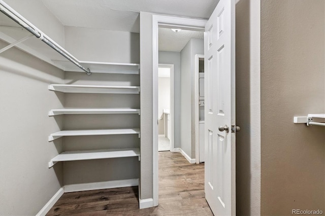 447 S Memphis Way Unit 7, Aurora, CO 80017 - spacious closet with wood finished floors