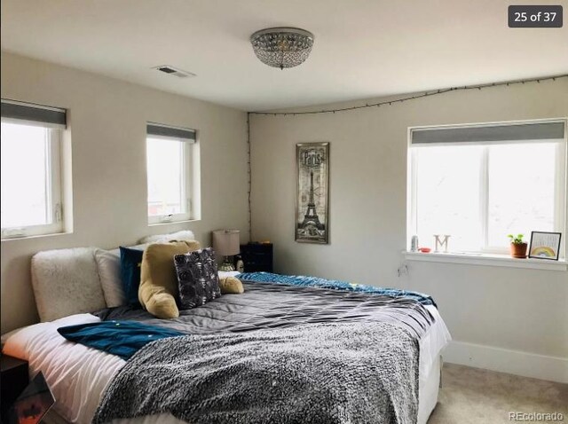 4428 Perry St, Denver, CO 80212 - carpeted bedroom featuring multiple windows