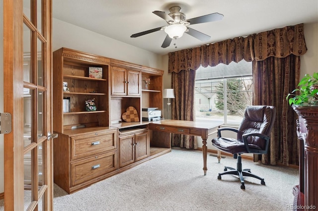 office featuring french doors, a ceiling fan, and carpet flooring