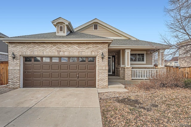 view of front facade with a garage and covered porch