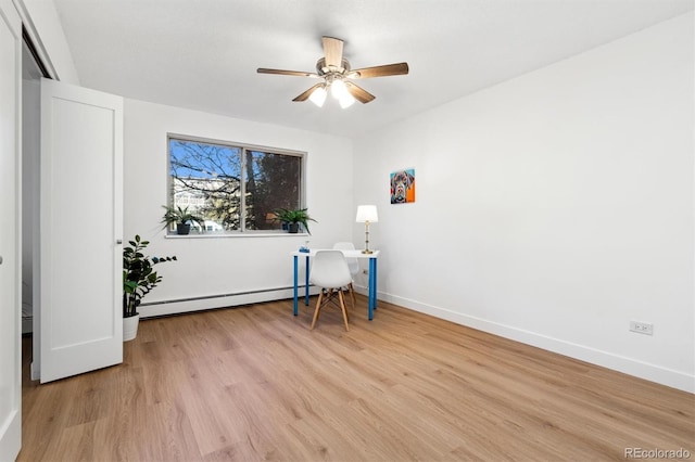 interior space featuring ceiling fan, light hardwood / wood-style floors, and baseboard heating