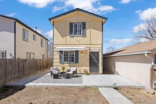 1343 Valentia St, Denver, CO 80220 - rear view of property featuring an outdoor hangout area, a patio area, and a fenced backyard