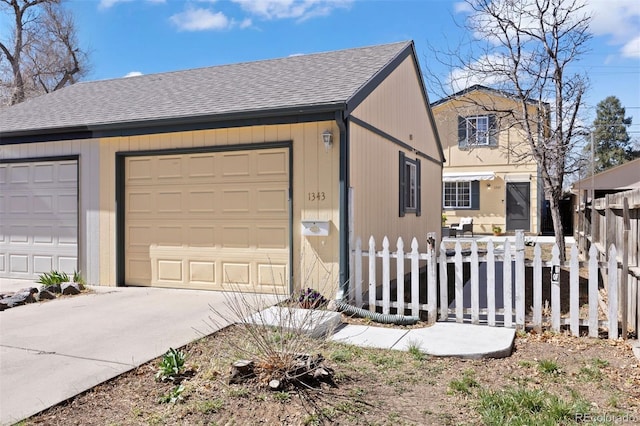 1343 Valentia St, Denver, CO 80220 - view of home's exterior with a shingled roof and a garage