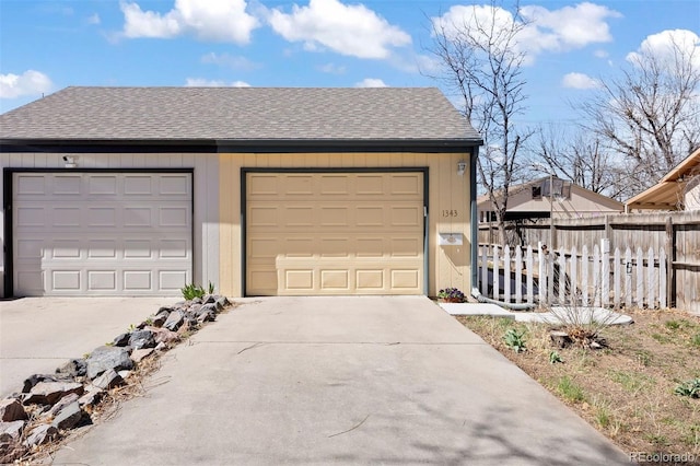 1343 Valentia St, Denver, CO 80220 - garage featuring driveway