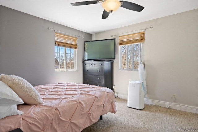 1343 Valentia St, Denver, CO 80220 - bedroom featuring multiple windows, carpet, ceiling fan, and baseboards