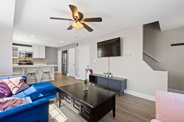 1343 Valentia St, Denver, CO 80220 - living area with baseboards, wood finished floors, a ceiling fan, and recessed lighting