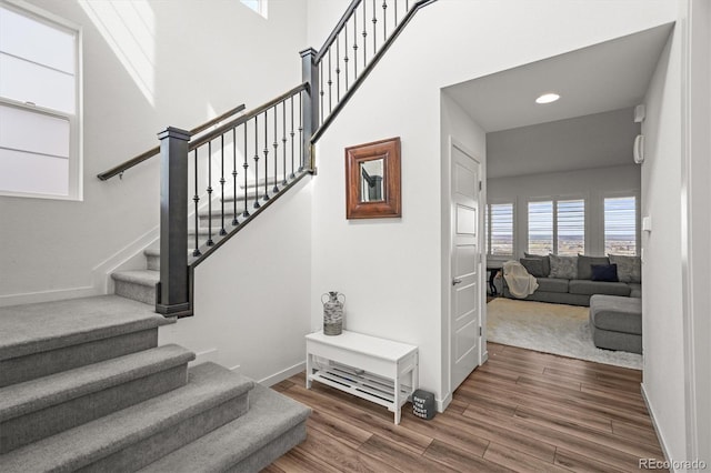 14102 Night Owl Ln, Parker, CO 80134 - stairway featuring wood finished floors, baseboards, and recessed lighting