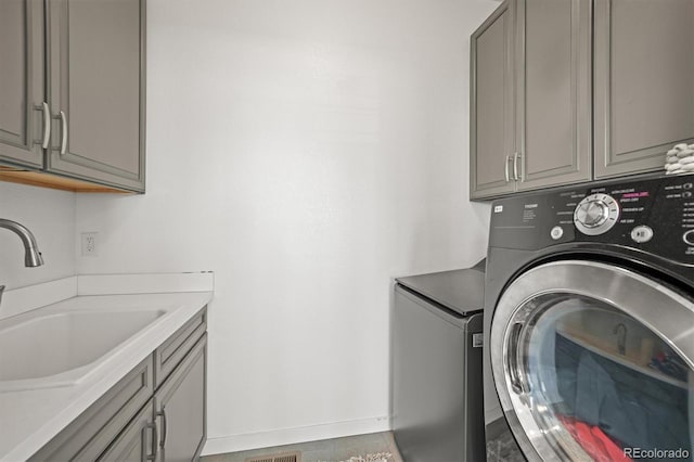 14102 Night Owl Ln, Parker, CO 80134 - laundry area with washer / dryer, cabinet space, and baseboards