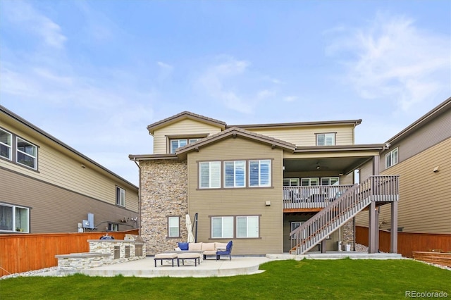 14102 Night Owl Ln, Parker, CO 80134 - rear view of property with an outdoor hangout area, stairway, a patio, an outdoor kitchen, and a wooden deck