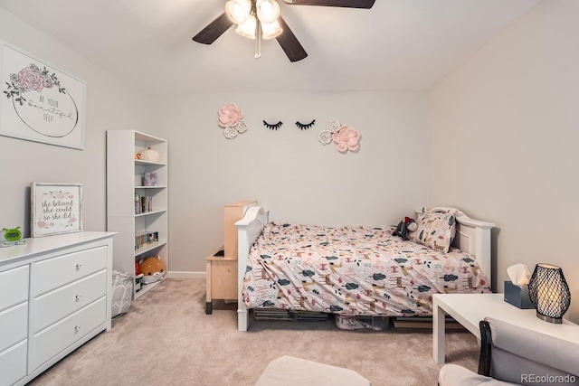 bedroom with ceiling fan and light carpet