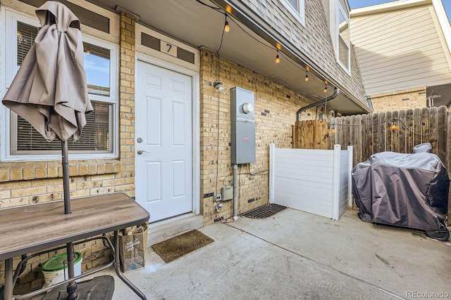 entrance to property featuring a patio