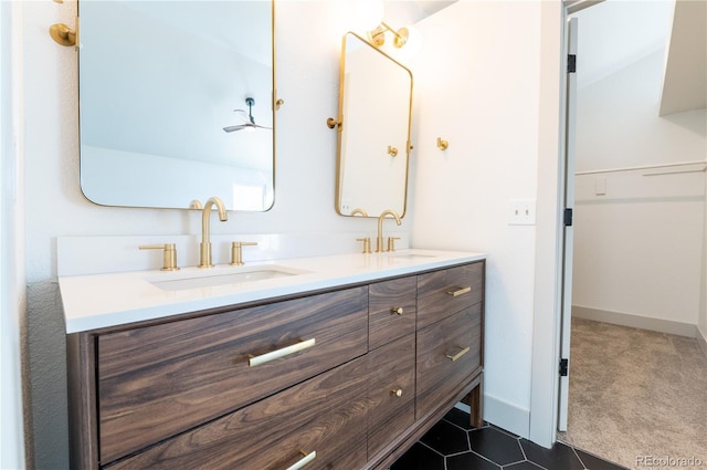 bathroom with tile patterned floors and vanity