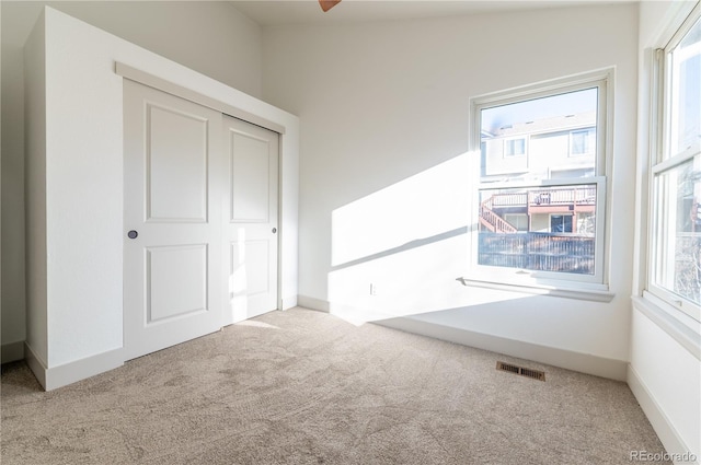 interior space with a healthy amount of sunlight and lofted ceiling