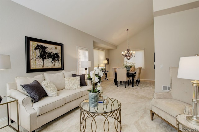 8101 E Dartmouth Ave Unit 22, Denver, CO 80231 - living room featuring a chandelier, light colored carpet, baseboards, and high vaulted ceiling