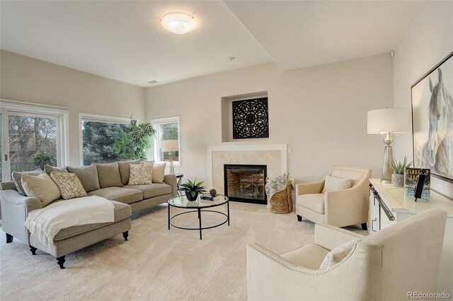 8101 E Dartmouth Ave Unit 22, Denver, CO 80231 - living area featuring a premium fireplace and light carpet