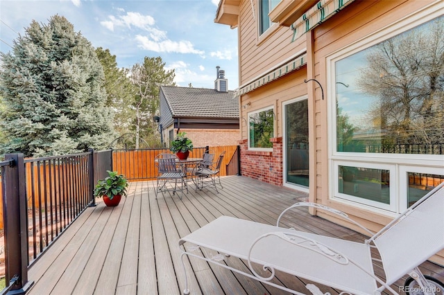 8101 E Dartmouth Ave Unit 22, Denver, CO 80231 - wooden deck featuring outdoor dining space