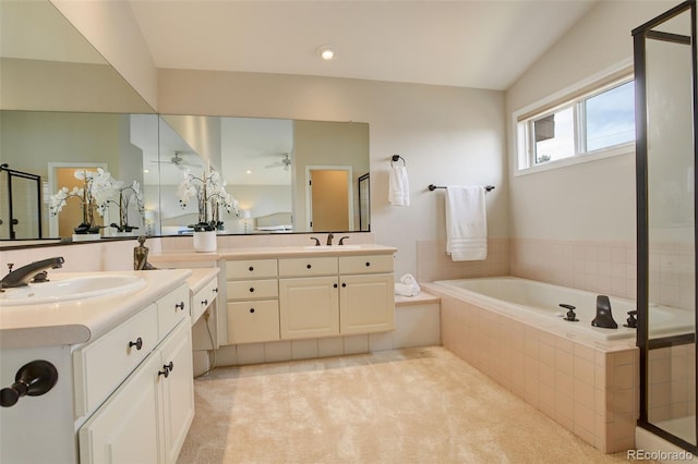 8101 E Dartmouth Ave Unit 22, Denver, CO 80231 - full bathroom with two vanities, a garden tub, an enclosed shower, ceiling fan, and recessed lighting