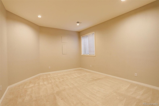8101 E Dartmouth Ave Unit 22, Denver, CO 80231 - spare room featuring light carpet, baseboards, and recessed lighting
