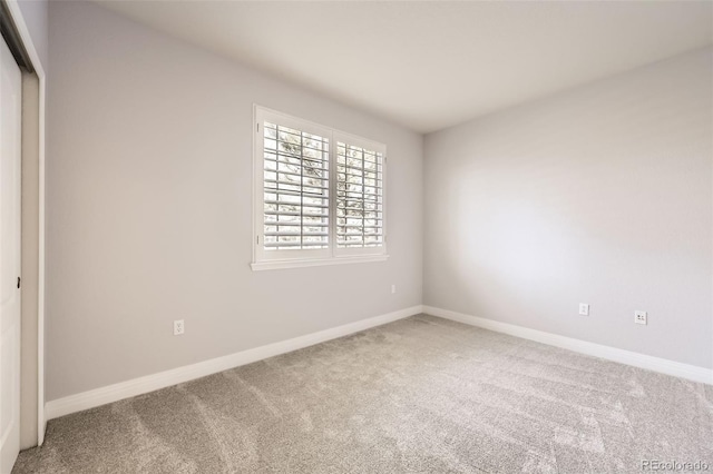 unfurnished bedroom featuring a closet and carpet flooring