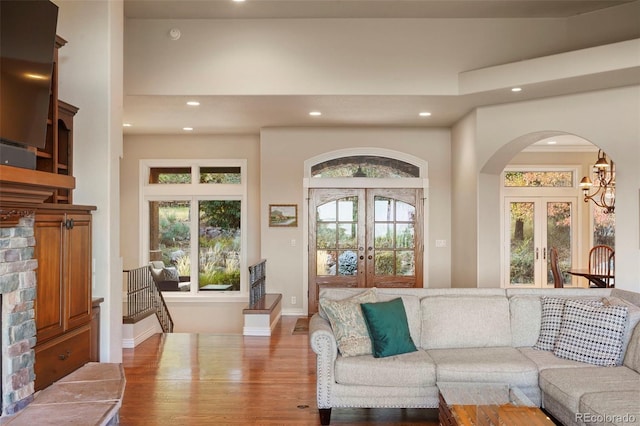 living room with wood-type flooring and french doors