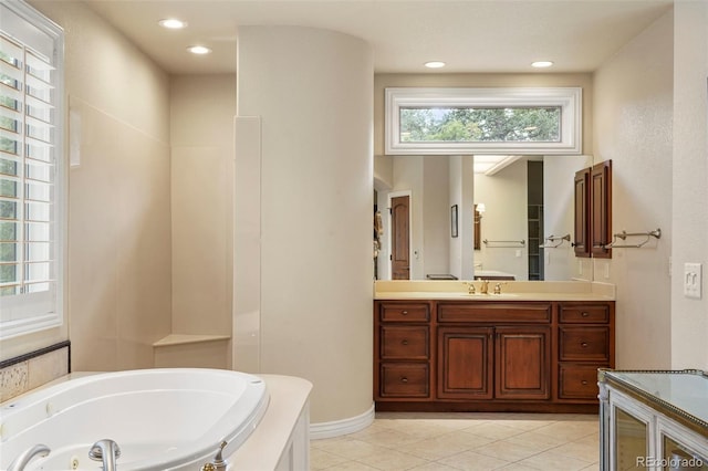 bathroom featuring vanity, a bathtub, and tile patterned flooring