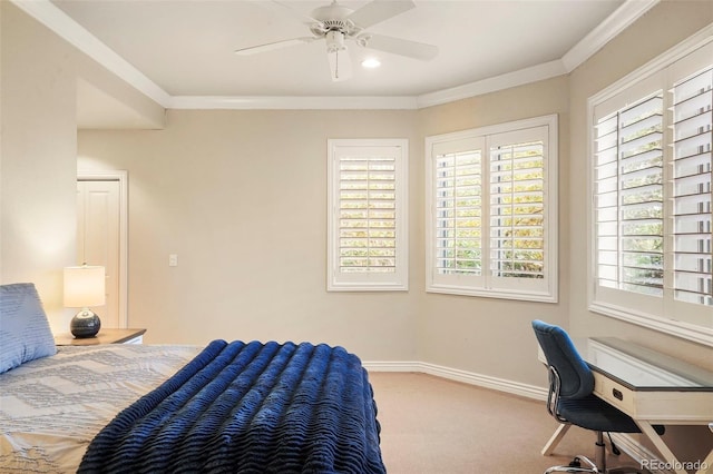 bedroom with ornamental molding, ceiling fan, and carpet