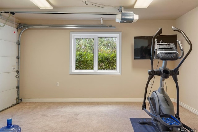 exercise room featuring light carpet