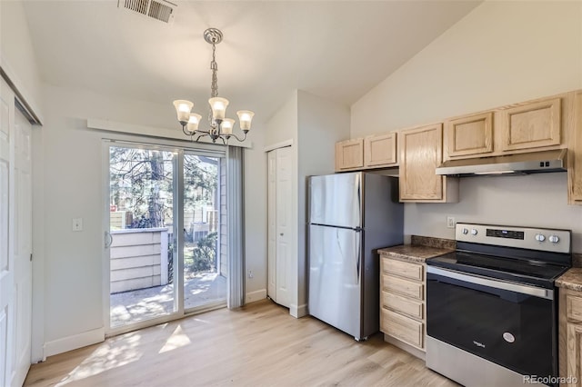 kitchen featuring stainless steel appliances, a notable chandelier, vaulted ceiling, and light hardwood / wood-style floors