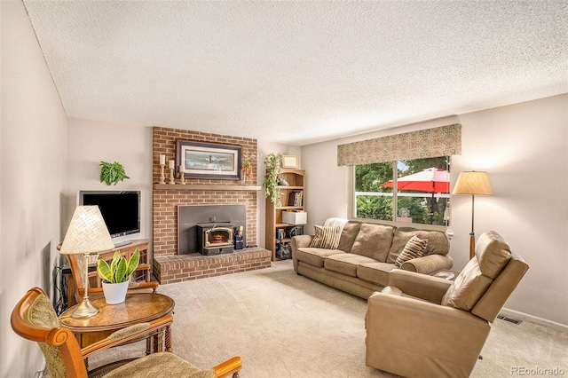 living room with light colored carpet, a wood stove, and a textured ceiling