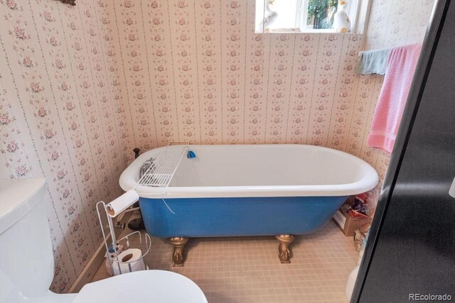17634 E Eldorado Pl, Aurora, CO 80013 - bathroom featuring wallpapered walls and a freestanding bath
