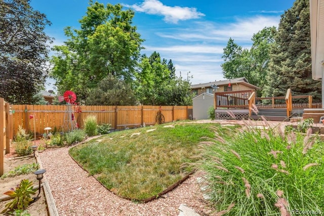 17634 E Eldorado Pl, Aurora, CO 80013 - fenced backyard featuring a wooden deck and a shed