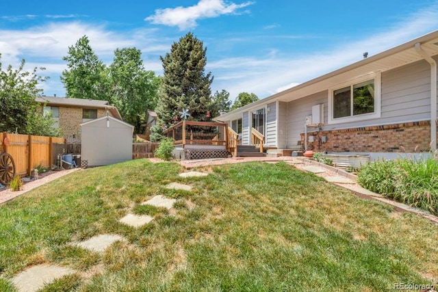 17634 E Eldorado Pl, Aurora, CO 80013 - fenced backyard with a storage shed and a wooden deck