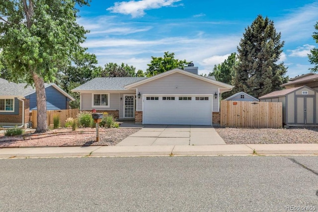 17634 E Eldorado Pl, Aurora, CO 80013 - ranch-style home featuring a garage, brick siding, concrete driveway, a storage shed, and a chimney
