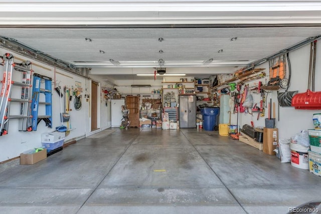 17634 E Eldorado Pl, Aurora, CO 80013 - garage featuring a garage door opener and a workshop area