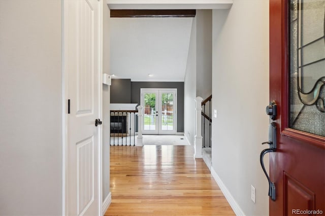 8174 Dudley Cir, Arvada, CO 80005 - entryway with light wood finished floors, stairs, baseboards, crown molding, and french doors