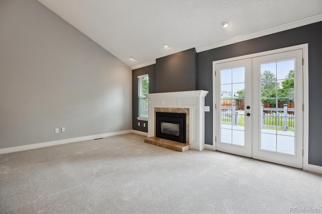 8174 Dudley Cir, Arvada, CO 80005 - unfurnished living room featuring french doors, carpet, baseboards, crown molding, and a premium fireplace