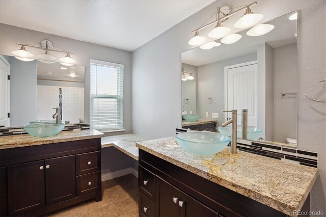 8174 Dudley Cir, Arvada, CO 80005 - bathroom with two vanities and tile patterned flooring