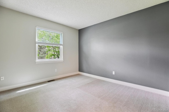 8174 Dudley Cir, Arvada, CO 80005 - carpeted spare room featuring a textured ceiling and baseboards